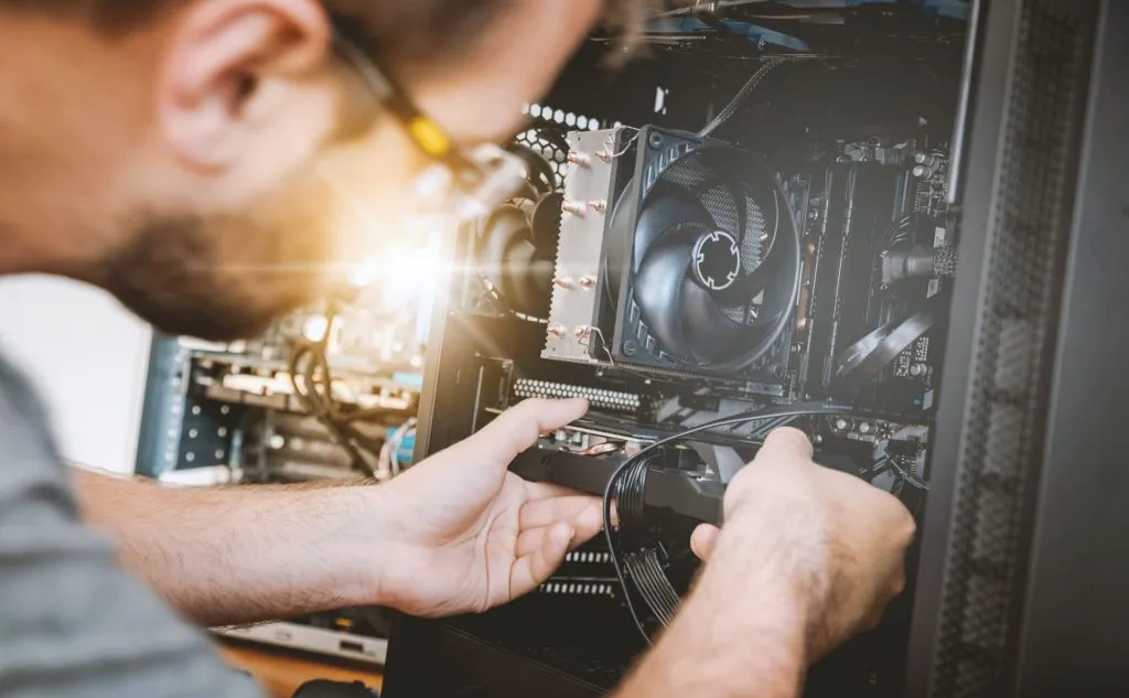 man working on a computer at one of the Best IT Support Companies for Accountants